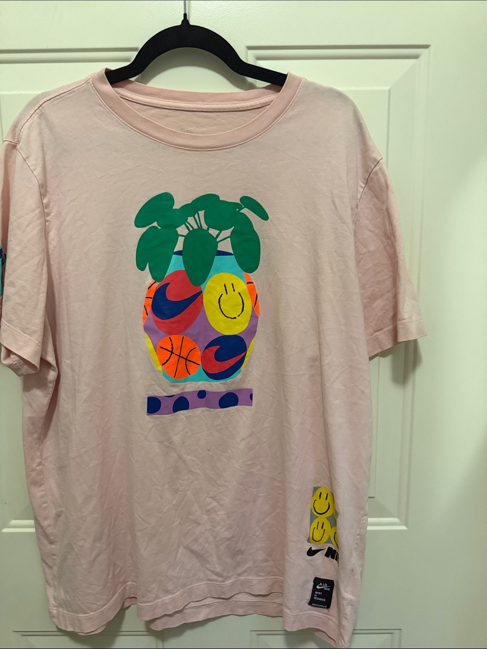 Nike Men’s Artist in Residence David Bruce Basketball Tee in light pink